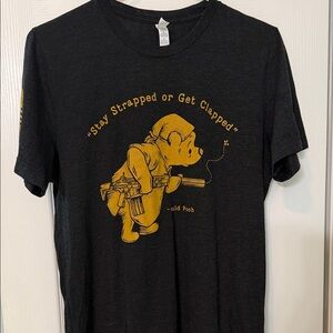 NineLine Apparel Stay Strapped Graphic Tee in Black and Gold